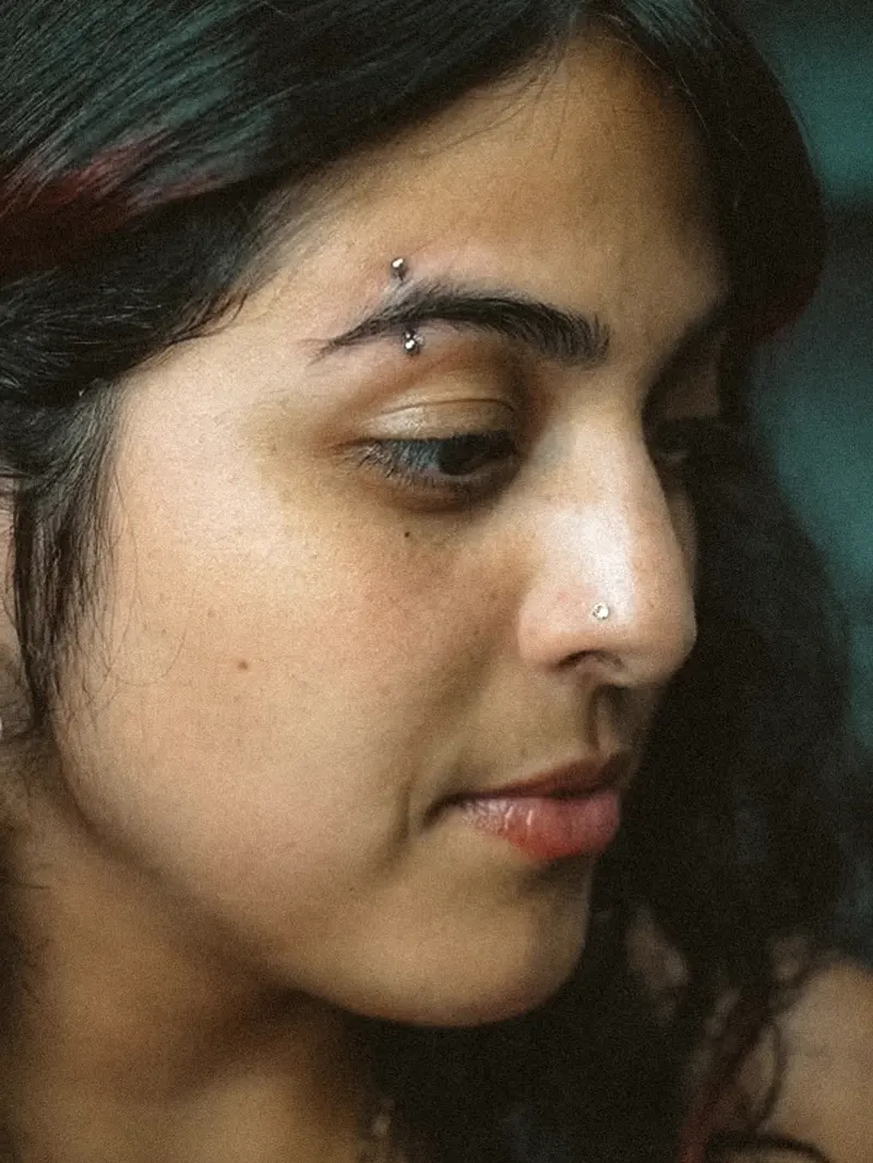 Eyebrow and nostril — piercing by Foenix Ink, Hollywood FL, implant-grade titanium