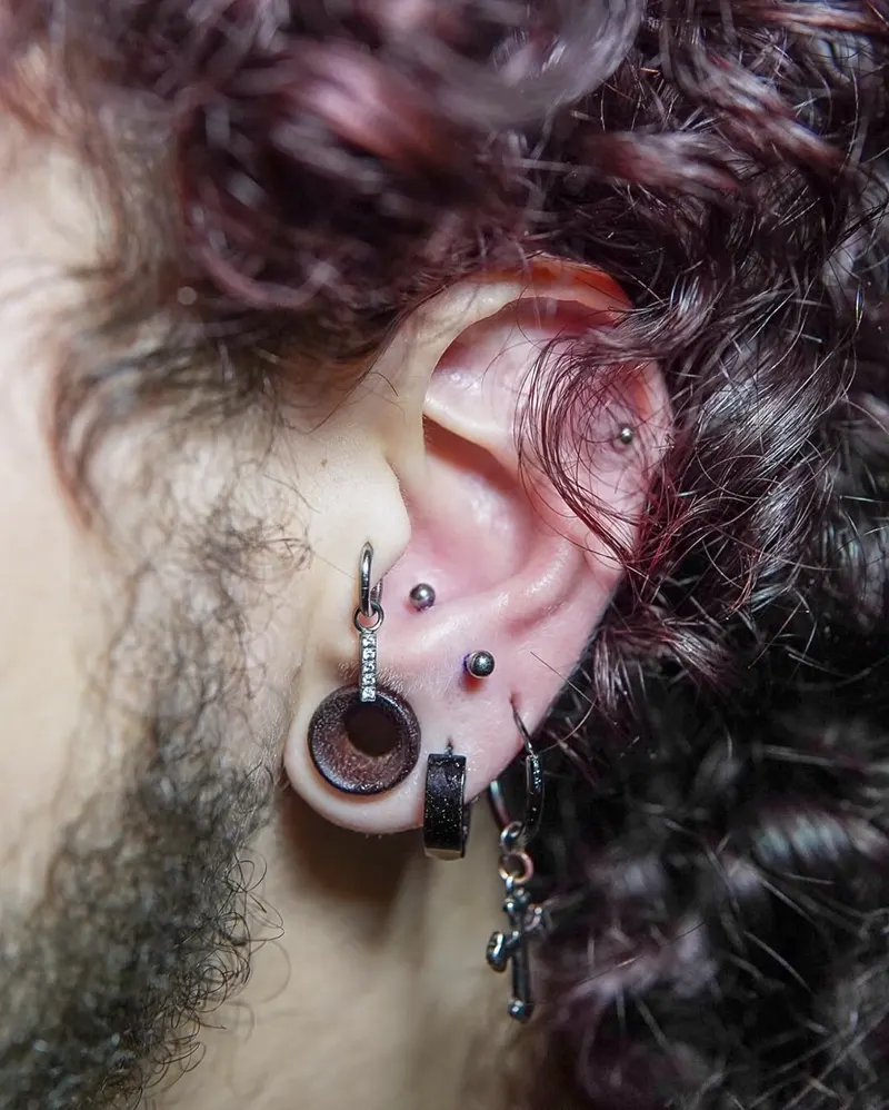 Stretched lobe with conch — piercing by Foenix Ink, Hollywood FL, implant-grade titanium (1/3)