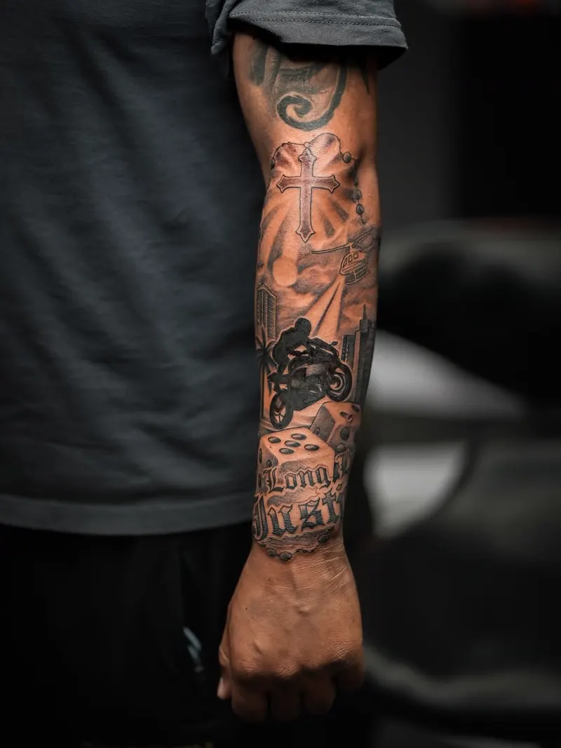 Cross, motorcycle and lettering sleeve — black & grey realism tattoo on the forearm sleeve, by Foenix Ink, Hollywood FL (1/3)