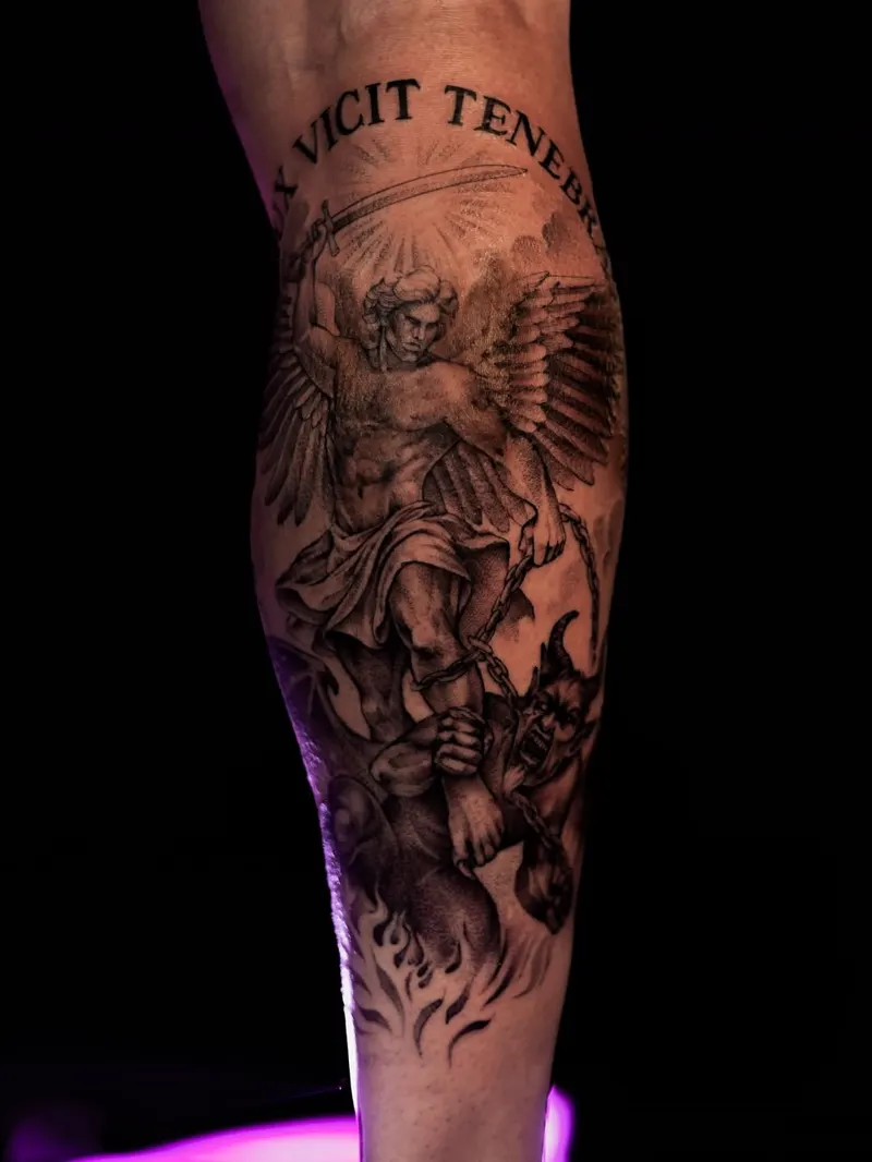 Archangel Michael with "Vicit Tenebras" — black & grey realism tattoo on the calf, by Foenix Ink, Hollywood FL