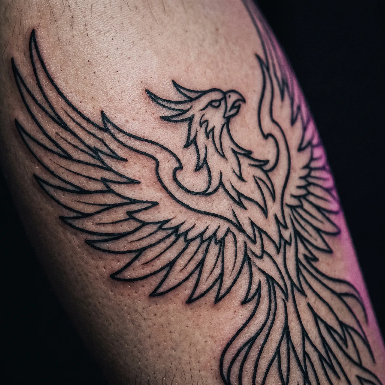 Freshly outlined black and grey tattoo linework before shading begins
