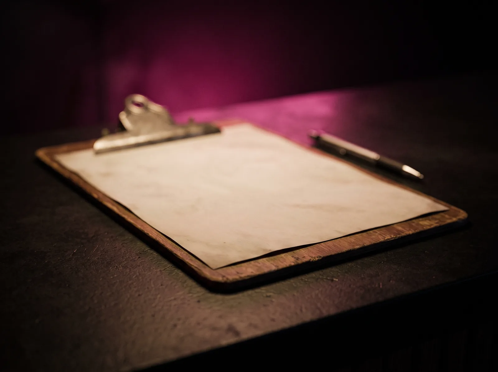 Consent form and clipboard resting on the studio front counter