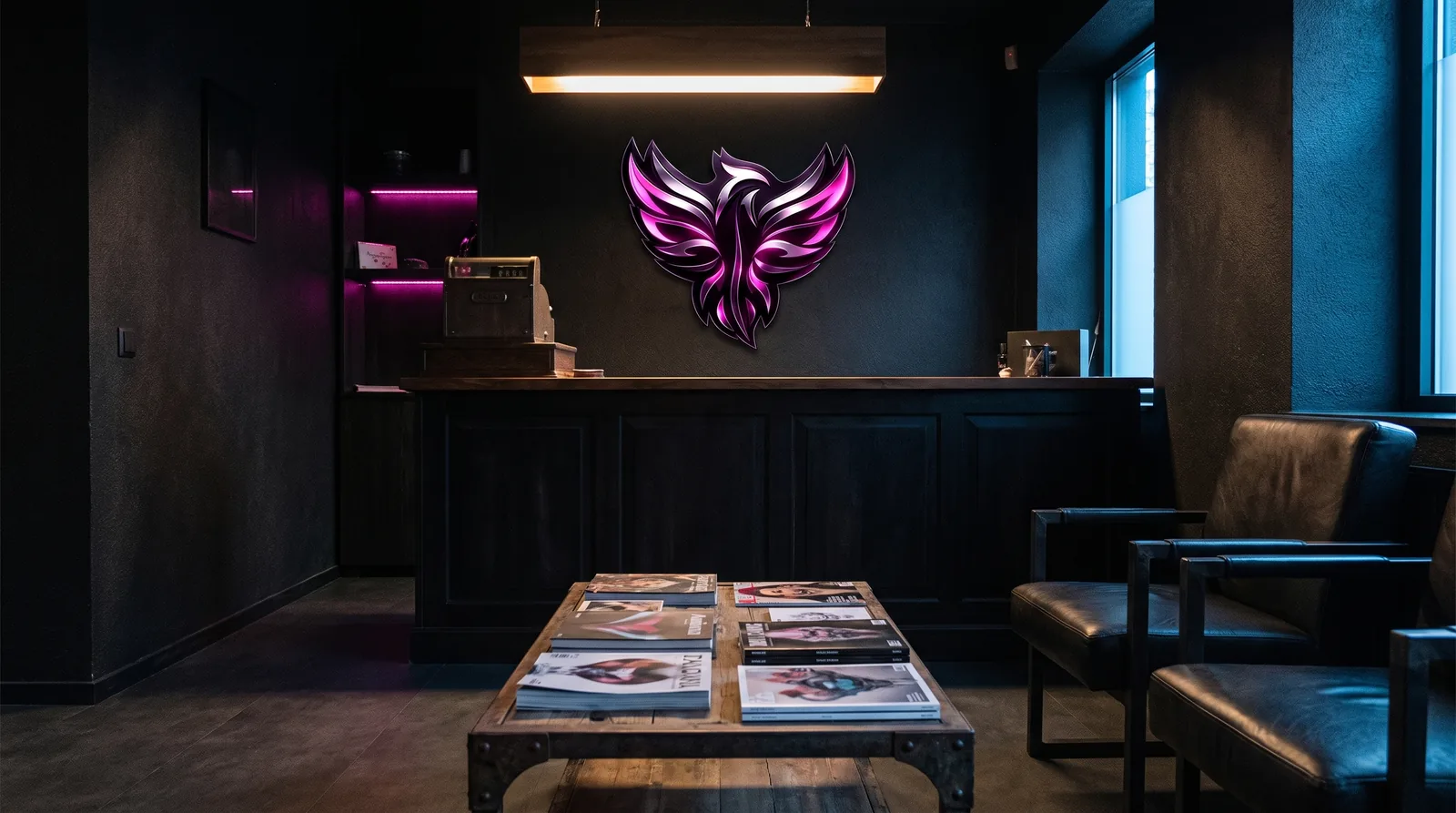 Tattoo studio front counter and waiting area with a phoenix emblem on the wall